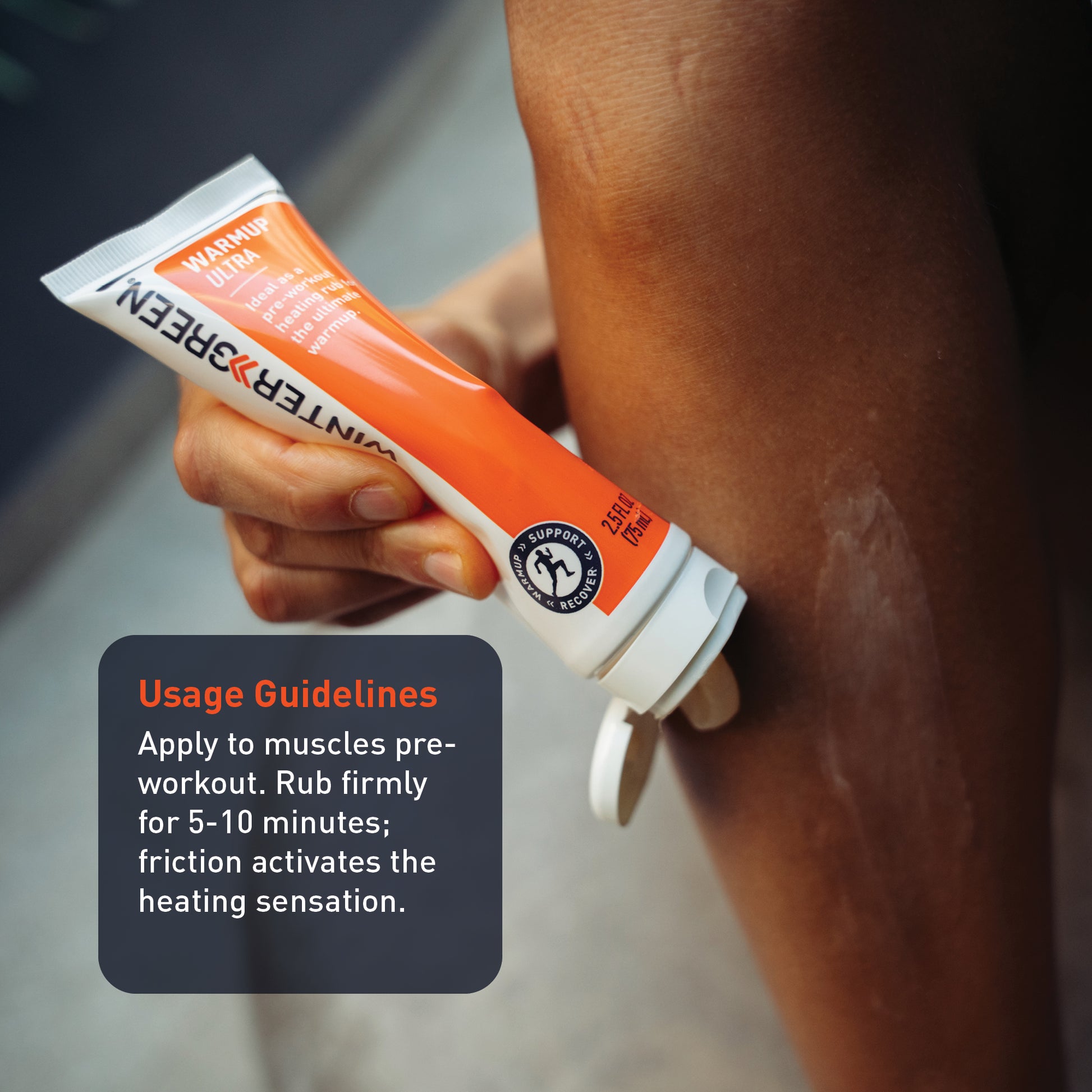 Person applying a tube of Wintergreen Warmup Ultra to their arm with usage guidelines displayed.